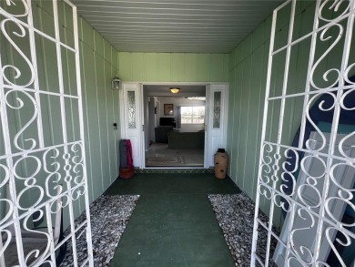 This Adorable Pool Home is located at the end of a cul-de-sac on on Port Charlotte Golf Club in Florida - for sale on GolfHomes.com, golf home, golf lot