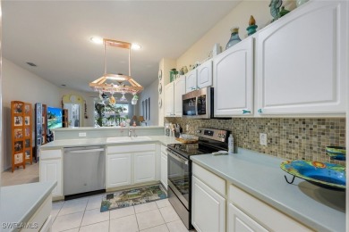 CHARMING WESTERN EXPOSURE 2-BEDROOM VILLA WITH STUNNING LAKE on Herons Glen Golf and Country Club in Florida - for sale on GolfHomes.com, golf home, golf lot