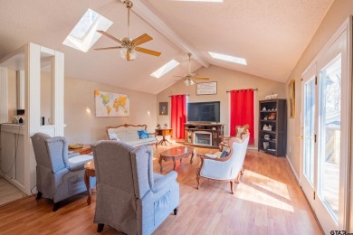 Located in the gated community of Hideaway Lake, this inviting on Hide-A-Way Lake Golf Course in Texas - for sale on GolfHomes.com, golf home, golf lot