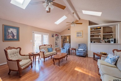 Located in the gated community of Hideaway Lake, this inviting on Hide-A-Way Lake Golf Course in Texas - for sale on GolfHomes.com, golf home, golf lot