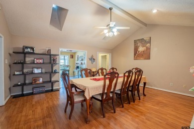 Located in the gated community of Hideaway Lake, this inviting on Hide-A-Way Lake Golf Course in Texas - for sale on GolfHomes.com, golf home, golf lot