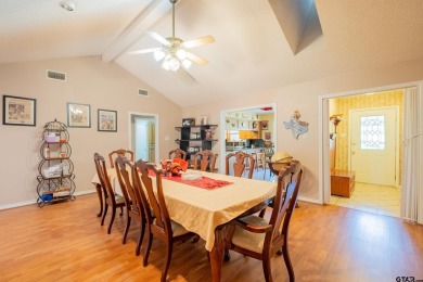 Located in the gated community of Hideaway Lake, this inviting on Hide-A-Way Lake Golf Course in Texas - for sale on GolfHomes.com, golf home, golf lot