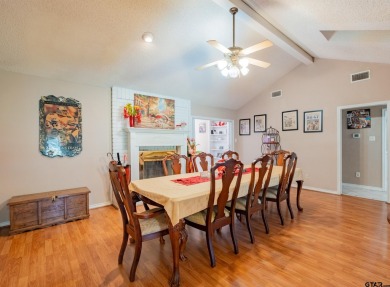 Located in the gated community of Hideaway Lake, this inviting on Hide-A-Way Lake Golf Course in Texas - for sale on GolfHomes.com, golf home, golf lot