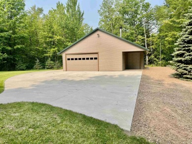 Welcome to your Lakewood retreat! Situated on 1.5 scenic acres on McCauslin Brook Golf and Country Club in Wisconsin - for sale on GolfHomes.com, golf home, golf lot