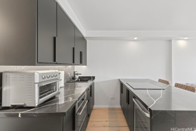 This beautifully updated, fully furnished unit offers stunning on Ala Wai Golf Course in Hawaii - for sale on GolfHomes.com, golf home, golf lot