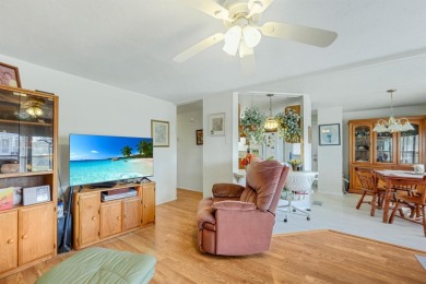 This charming 2-bedroom, 2-bathroom home is situated on a on Maple Leaf Golf and Country Club in Florida - for sale on GolfHomes.com, golf home, golf lot