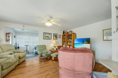 This charming 2-bedroom, 2-bathroom home is situated on a on Maple Leaf Golf and Country Club in Florida - for sale on GolfHomes.com, golf home, golf lot