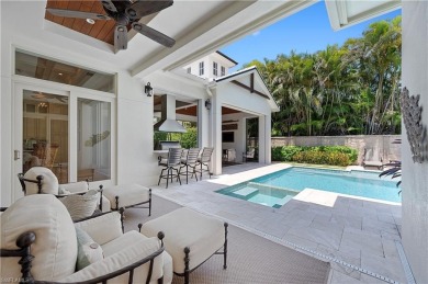 In the heart of the Moorings sits a picture-perfect single story on The Moorings Country Club in Florida - for sale on GolfHomes.com, golf home, golf lot