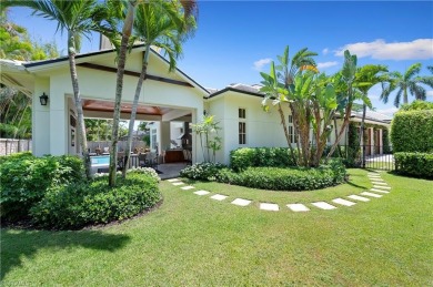 In the heart of the Moorings sits a picture-perfect single story on The Moorings Country Club in Florida - for sale on GolfHomes.com, golf home, golf lot