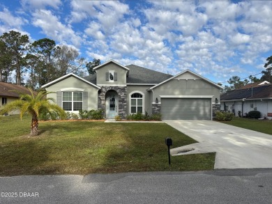 Welcome to 5 Wayside Pl, a beautifully crafted 4-bedroom on The Grand Club - Pine Lakes Course in Florida - for sale on GolfHomes.com, golf home, golf lot