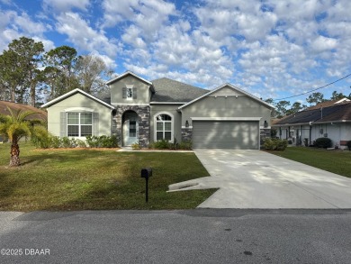 Welcome to 5 Wayside Pl, a beautifully crafted 4-bedroom on The Grand Club - Pine Lakes Course in Florida - for sale on GolfHomes.com, golf home, golf lot