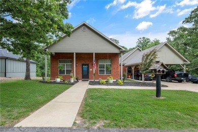 Welcome to your private escape in Bella Vista, Arkansas! Tucked on Bella Vista Country Club - Highlands in Arkansas - for sale on GolfHomes.com, golf home, golf lot