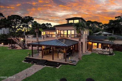 Discover the pinnacle of Lowcountry living at 618 Dolphin Annex on Ocean Point Golf Links in South Carolina - for sale on GolfHomes.com, golf home, golf lot