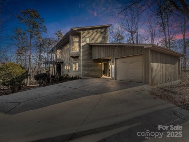 Modern farmhouse meets contemporary chic in this beautiful on Rumbling Bald Resort on Lake Lure in North Carolina - for sale on GolfHomes.com, golf home, golf lot