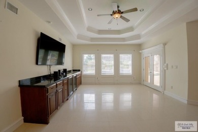 This beautiful 4-bedroom, 3.5-bath home with a finished 3-car on South Padre Island Golf Club in Texas - for sale on GolfHomes.com, golf home, golf lot