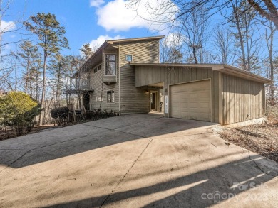 Modern farmhouse meets contemporary chic in this beautiful on Rumbling Bald Resort on Lake Lure in North Carolina - for sale on GolfHomes.com, golf home, golf lot