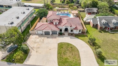 This beautiful 4-bedroom, 3.5-bath home with a finished 3-car on South Padre Island Golf Club in Texas - for sale on GolfHomes.com, golf home, golf lot