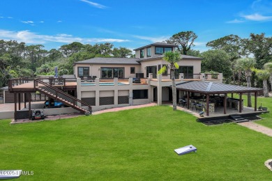 Discover the pinnacle of Lowcountry living at 618 Dolphin Annex on Ocean Point Golf Links in South Carolina - for sale on GolfHomes.com, golf home, golf lot