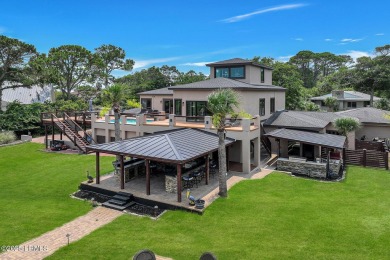 Discover the pinnacle of Lowcountry living at 618 Dolphin Annex on Ocean Point Golf Links in South Carolina - for sale on GolfHomes.com, golf home, golf lot