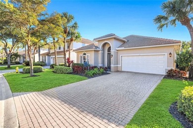 This impeccably maintained residence is nestled within Laurel on Shadow Wood Country Club in Florida - for sale on GolfHomes.com, golf home, golf lot
