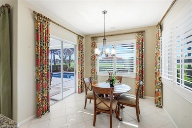 This impeccably maintained residence is nestled within Laurel on Shadow Wood Country Club in Florida - for sale on GolfHomes.com, golf home, golf lot