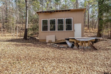 Nestled in the heart of the scenic Pineywoods, this charming on Pine Dunes Golf Course in Texas - for sale on GolfHomes.com, golf home, golf lot