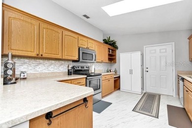 Fabulous, updated 2-bedroom 2 bath Palm model on the Golf Course on The Links of Spruce Creek in Florida - for sale on GolfHomes.com, golf home, golf lot