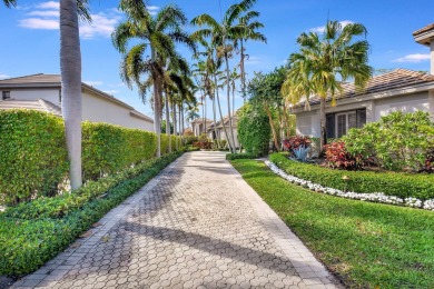 Experience luxury living at its finest in this elegant & on Broken Sound Golf and Club  in Florida - for sale on GolfHomes.com, golf home, golf lot