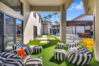 Experience luxury living at its finest in this elegant & on Broken Sound Golf and Club  in Florida - for sale on GolfHomes.com, golf home, golf lot
