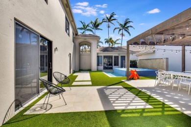 Experience luxury living at its finest in this elegant & on Broken Sound Golf and Club  in Florida - for sale on GolfHomes.com, golf home, golf lot