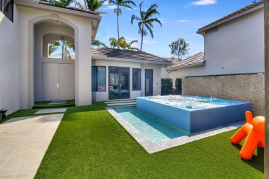 Experience luxury living at its finest in this elegant & on Broken Sound Golf and Club  in Florida - for sale on GolfHomes.com, golf home, golf lot