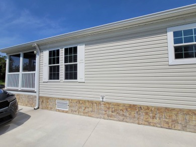 Looking for that big home? This 3/2 home has at least 1700 sq ft on Pelican Pointe 9 Hole Course in Florida - for sale on GolfHomes.com, golf home, golf lot