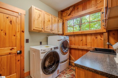 Discover mountain living at its finest with this timeless timber on The Cliffs at Glassy Golf and Country Club in South Carolina - for sale on GolfHomes.com, golf home, golf lot