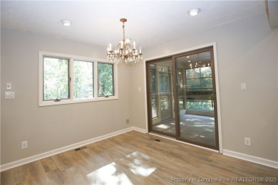 Welcome to this stunning 3-bedroom, 3-bath all-brick home on Woodlake Country Club in North Carolina - for sale on GolfHomes.com, golf home, golf lot