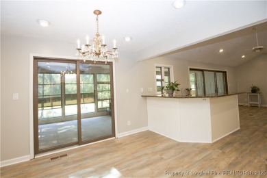 Welcome to this stunning 3-bedroom, 3-bath all-brick home on Woodlake Country Club in North Carolina - for sale on GolfHomes.com, golf home, golf lot