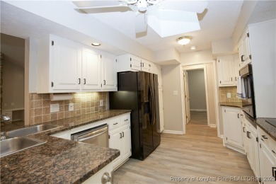 Welcome to this stunning 3-bedroom, 3-bath all-brick home on Woodlake Country Club in North Carolina - for sale on GolfHomes.com, golf home, golf lot