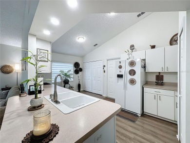 Walk into this modernized Canterbury model located in 55+ gated on Kings Ridge Golf Club in Florida - for sale on GolfHomes.com, golf home, golf lot