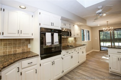 Welcome to this stunning 3-bedroom, 3-bath all-brick home on Woodlake Country Club in North Carolina - for sale on GolfHomes.com, golf home, golf lot