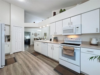 Walk into this modernized Canterbury model located in 55+ gated on Kings Ridge Golf Club in Florida - for sale on GolfHomes.com, golf home, golf lot