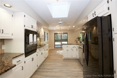 Welcome to this stunning 3-bedroom, 3-bath all-brick home on Woodlake Country Club in North Carolina - for sale on GolfHomes.com, golf home, golf lot