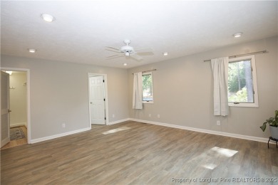 Welcome to this stunning 3-bedroom, 3-bath all-brick home on Woodlake Country Club in North Carolina - for sale on GolfHomes.com, golf home, golf lot