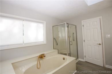 Welcome to this stunning 3-bedroom, 3-bath all-brick home on Woodlake Country Club in North Carolina - for sale on GolfHomes.com, golf home, golf lot