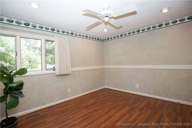 Welcome to this stunning 3-bedroom, 3-bath all-brick home on Woodlake Country Club in North Carolina - for sale on GolfHomes.com, golf home, golf lot