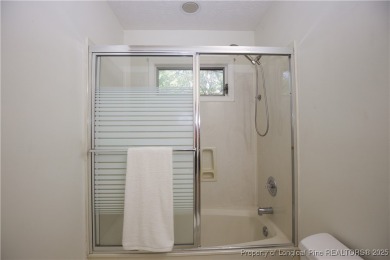 Welcome to this stunning 3-bedroom, 3-bath all-brick home on Woodlake Country Club in North Carolina - for sale on GolfHomes.com, golf home, golf lot