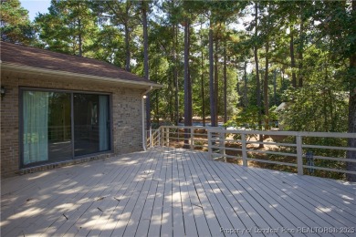 Welcome to this stunning 3-bedroom, 3-bath all-brick home on Woodlake Country Club in North Carolina - for sale on GolfHomes.com, golf home, golf lot