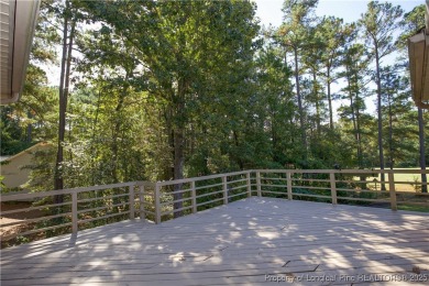Welcome to this stunning 3-bedroom, 3-bath all-brick home on Woodlake Country Club in North Carolina - for sale on GolfHomes.com, golf home, golf lot