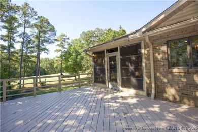 Welcome to this stunning 3-bedroom, 3-bath all-brick home on Woodlake Country Club in North Carolina - for sale on GolfHomes.com, golf home, golf lot