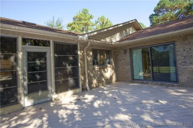 Welcome to this stunning 3-bedroom, 3-bath all-brick home on Woodlake Country Club in North Carolina - for sale on GolfHomes.com, golf home, golf lot