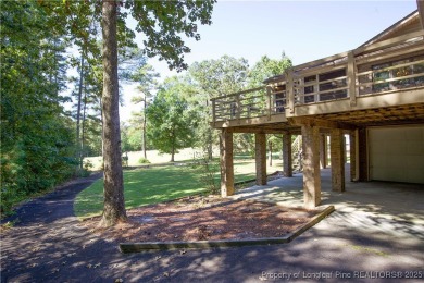Welcome to this stunning 3-bedroom, 3-bath all-brick home on Woodlake Country Club in North Carolina - for sale on GolfHomes.com, golf home, golf lot