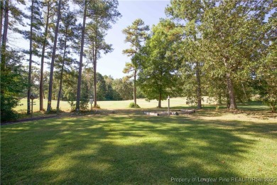 Welcome to this stunning 3-bedroom, 3-bath all-brick home on Woodlake Country Club in North Carolina - for sale on GolfHomes.com, golf home, golf lot